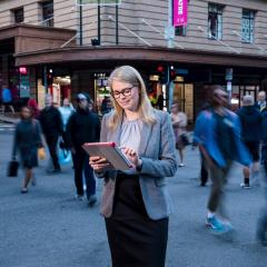 women holding ipad